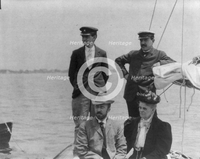 New York Yacht Club, Oyster Bay, L.I., 1905: 2 men with man and woman watching yacht race, 1905. Creator: Frances Benjamin Johnston.