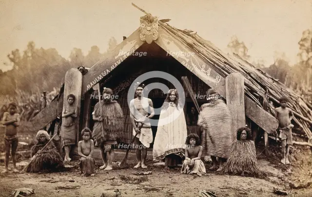 New Zealand: a group of Maori in front of a traditional building, 19th century. Creator: Unknown.