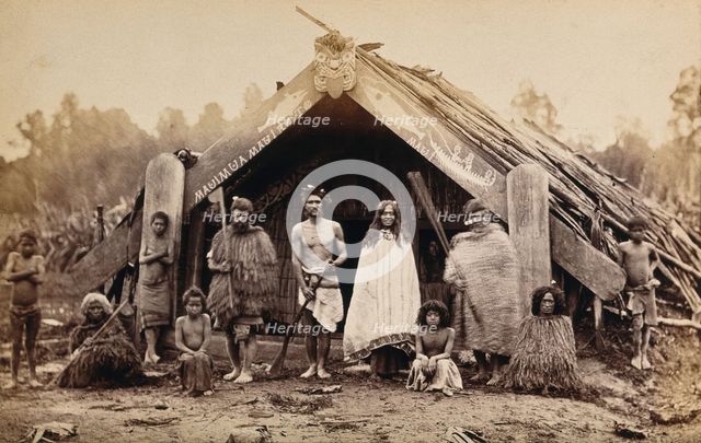 New Zealand: a group of Maori in front of a traditional building, 19th century. Creator: Unknown.