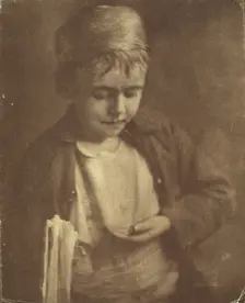 Newsboy looking at coins in his hand, half-length portrait, c1900. Creator: Elizabeth B. Brownell