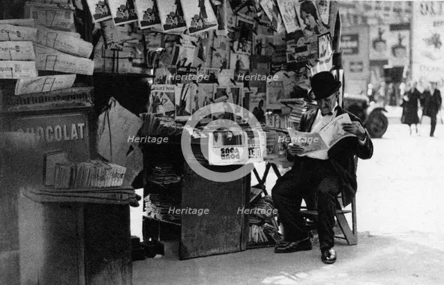 Newspaper stand, Paris, 1931.Artist: Ernest Flammarion