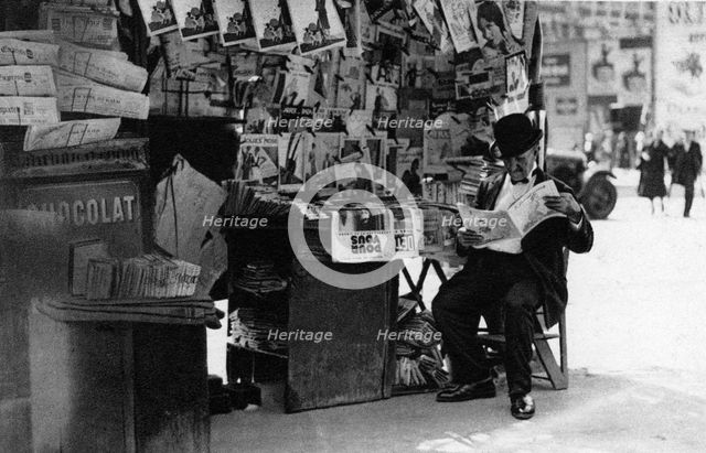 Newspaper stand, Paris, 1931.Artist: Ernest Flammarion