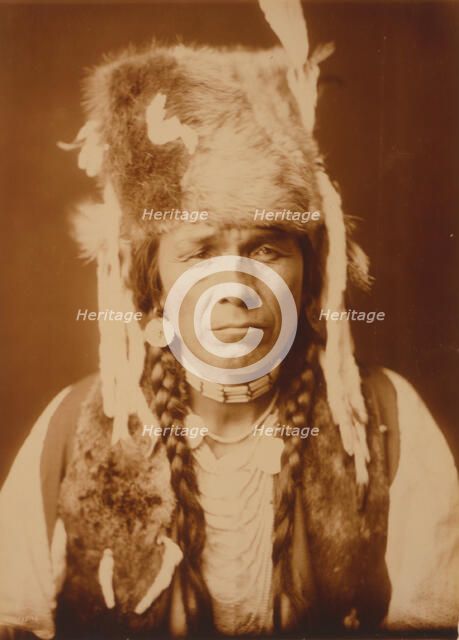 Nez Percé with furcap, c1904. Creator: Edward Sheriff Curtis.