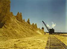 Nearly exhausted sulphur vat from which railroad..., Freeport Sulphur Co, Hoskins Mound, Texas, 1943 Creator: John Vachon
