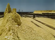 Nearly exhausted sulphur vat from which railroad..., Freeport Sulphur Co, Hoskins Mound, Texas, 1943 Creator: John Vachon