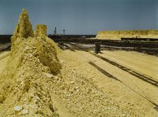 Nearly exhausted sulphur vat from which railroad..., Freeport Sulphur Co, Hoskins Mound, Texas, 1943 Creator: John Vachon