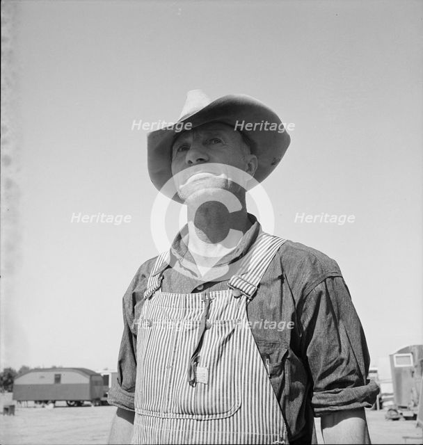 Nebraska farmer come to pick peas, near Calipatria, California, 1939. Creator: Dorothea Lange.