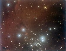 Nebulosity and star cluster in Serpens. Creator: NASA