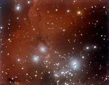 Nebulosity and star cluster in Serpens. Creator: NASA