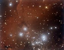 Nebulosity and star cluster in Serpens. Creator: NASA
