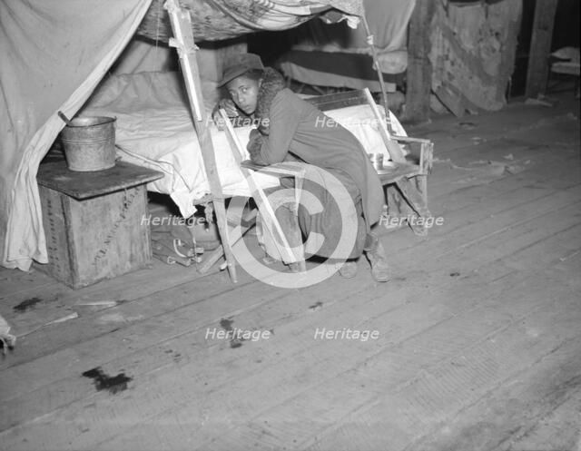 Negro girl in the temporary infirmary, Forrest City, Arkansas, 1937. Creator: Walker Evans.