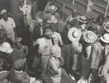 Negro day laborers brought in by truck from nearby towns, waiting to be paid off and..., Oct 1939. Creators: Farm Security Administration, Marion Post Wolcott