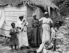 Negro family, Grant's Town, Nassau, W.I., between 1900 and 1906. Creator: William H. Jackson