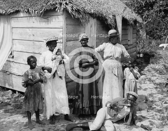 Negro family, Grant's Town, Nassau, W.I., between 1900 and 1906. Creator: William H. Jackson.