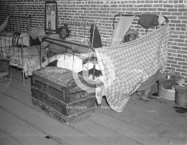 Negro flood refugees in the Red Cross temporary infirmary at Forrest City, Arkansas, 1937. Creator: Walker Evans.