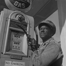 Negro mechanic for the Amoco oil company, Washington, D.C., 1942. Creator: Gordon Parks