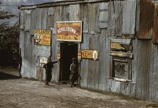 Negro migratory workers by a "juke joint" (?), Belle Glade, Fla., 1941. Creator: Marion Post Wolcott