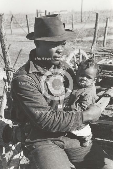 Negro sharecropper and son who will be resettled, Transylvania Project, Louisiana, Jan 1939. Creators: Farm Security Administration, Russell Lee.
