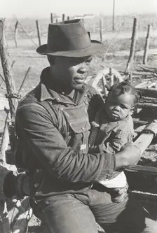 Negro sharecropper and son who will be resettled, Transylvania Project, Louisiana, Jan 1939. Creators: Farm Security Administration, Russell Lee