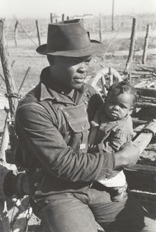 Negro sharecropper and son who will be resettled, Transylvania Project, Louisiana, Jan 1939. Creators: Farm Security Administration, Russell Lee