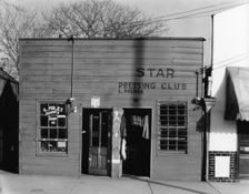 Negro shop, Shop fronts, laundry and barber shop, Vicksburg, Mississippi, 1936. Creator: Walker Evans