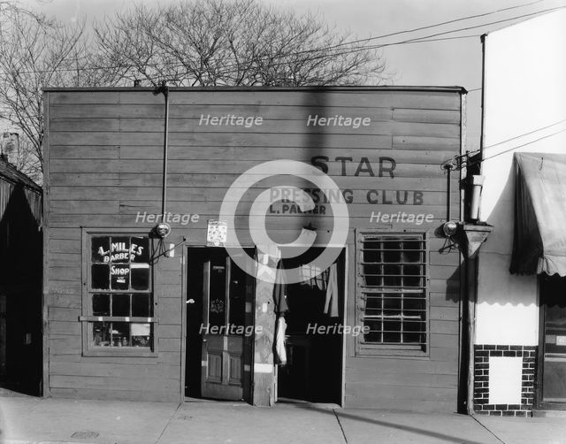 Negro shop, Shop fronts, laundry and barber shop, Vicksburg, Mississippi, 1936. Creator: Walker Evans.