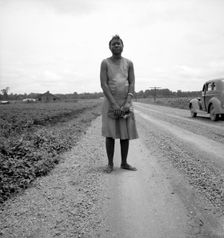 Negro woman carrying her shoes home..., Mississippi Delta, 1936. Creator: Dorothea Lange