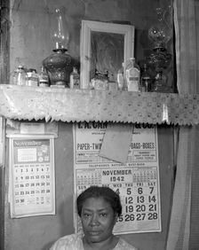 Negro woman in her home, Washington (southwest section), D.C., 1942. Creator: Gordon Parks