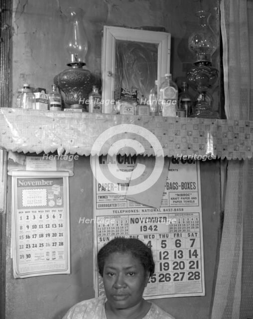 Negro woman in her home, Washington (southwest section), D.C., 1942. Creator: Gordon Parks.