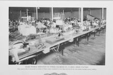 Negro women employed on power machines in a large apron factory, 1922. Creator: Unknown