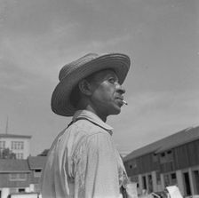 Negro waterboy for a housing construction gang, Washington, D.C., 1942. Creator: Gordon Parks