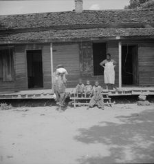 Negro wage laborer and part of his family, Macon County, Georgia, 1937. Creator: Dorothea Lange