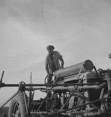 Negro tractor driver, Aldridge Plantation, Mississippi, 1937. Creator: Dorothea Lange