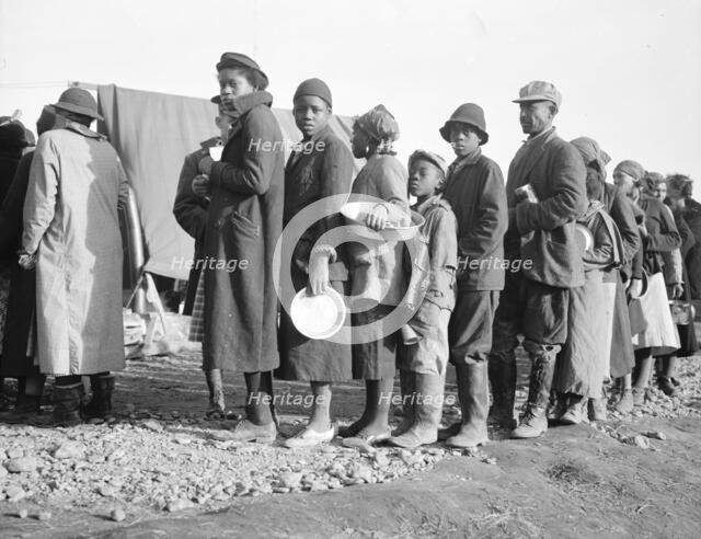 Negroes waiting for food in the Forrest City, Arkansas, concentration camp, 1937. Creator: Walker Evans.