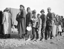 Negroes waiting for food in the Forrest City, Arkansas, concentration camp, 1937. Creator: Walker Evans