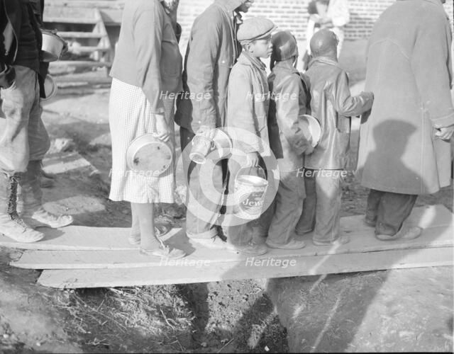 Negroes waiting for food in the Forrest City, Arkansas, refugee camp, 1937. Creator: Walker Evans.