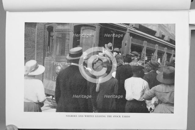 Negroes and Whites leaving the stock yards, 1922. Creator: Unknown.
