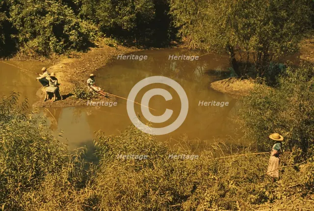 Negroes fishing in creek near cotton plantations outside Belzoni, Miss. Delta, 1939. Creator: Marion Post Wolcott.