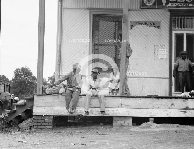 Negroes hanging around the plantation store, Mississippi Delta, 1936. Creator: Dorothea Lange.