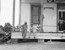 Negroes hanging around the plantation store, Mississippi Delta, 1936. Creator: Dorothea Lange