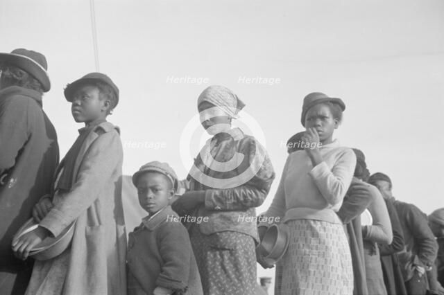 Negroes in the lineup for food at meal time in the camp for flood..., Forrest City, Arkansas, 1937. Creator: Walker Evans.