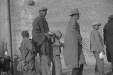 Negroes in the lineup for food at the flood refugee camp, Forrest City, Arkansas, 1937. Creator: Walker Evans