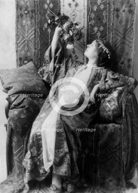 Neith Boyce Hapgood, full-length portrait, seated, left profile, wearing..., between 1890 and 1910. Creator: Frances Benjamin Johnston.