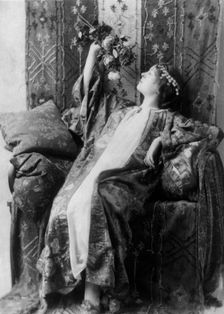 Neith Boyce Hapgood, full-length portrait, seated, left profile, wearing..., between 1890 and 1910. Creator: Frances Benjamin Johnston