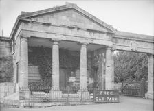 Neoclassical facade with Free Car Park sign, c1935. Creator: Kirk & Sons of Cowes