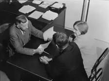 Night meeting in the FSA office, Visalia, Tulare County, California, 1938. Creator: Dorothea Lange