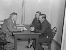 Night meeting in the FSA office, Visalia, Tulare County, California, 1938. Creator: Dorothea Lange
