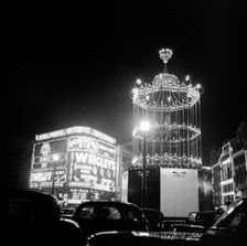 Night scene showing the neon lights of Piccadilly Circus, City of Westminster, c1945-c1965. Artist: SW Rawlings