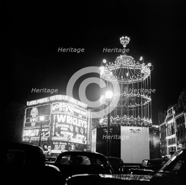 Night scene showing the neon lights of Piccadilly Circus, City of Westminster, c1945-c1965. Artist: SW Rawlings