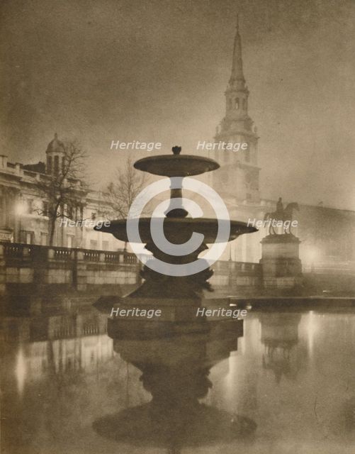 'Night Rain Has Turned The Pavements To A Pool of Reflections', c1935. Creator: Calkin.